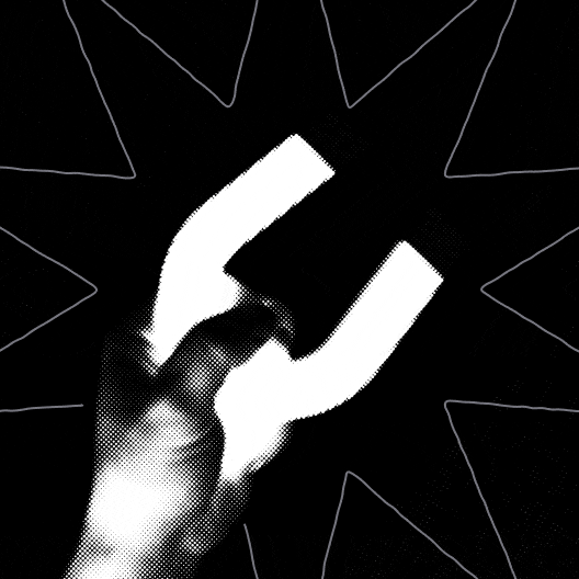 An image with a hand holding a magnet